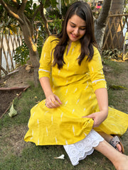 Mustard embroidered A-line kurta with pockets.