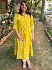 Mustard embroidered A-line kurta with pockets.