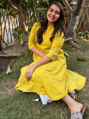 Mustard embroidered A-line kurta with pockets.