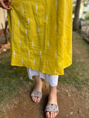 Mustard embroidered A-line kurta with pockets.