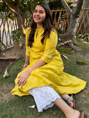 Mustard embroidered A-line kurta with pockets.