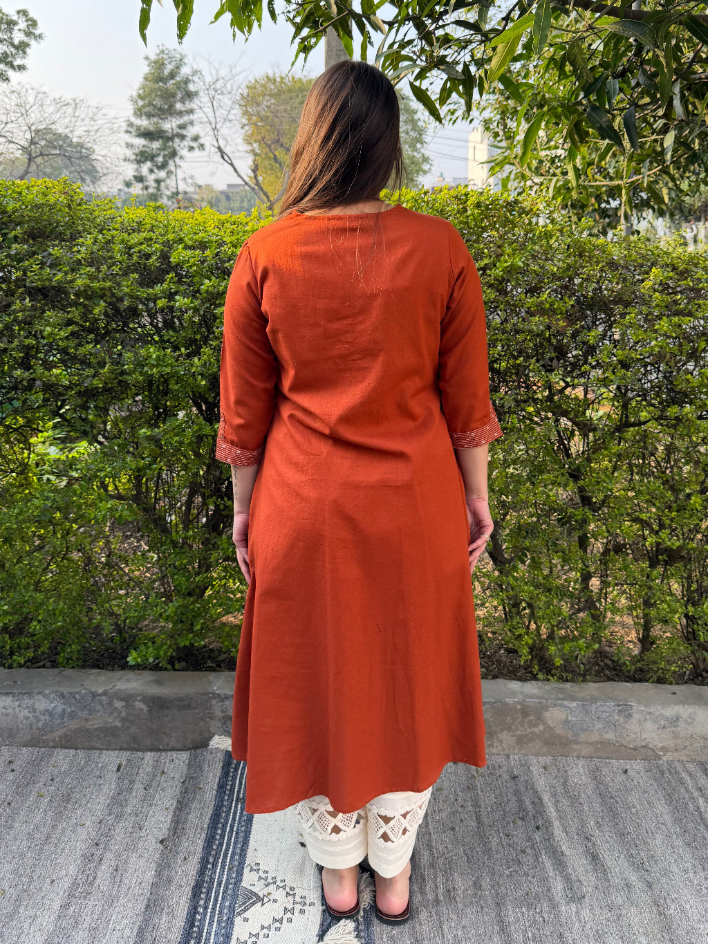 Rust Bloom Tassel A-line Kurta from the back by Sanskritam