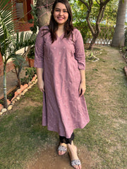 Onion pink embroidered A-line kurta with pockets.