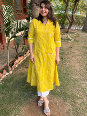 Mustard embroidered A-line kurta with pockets.