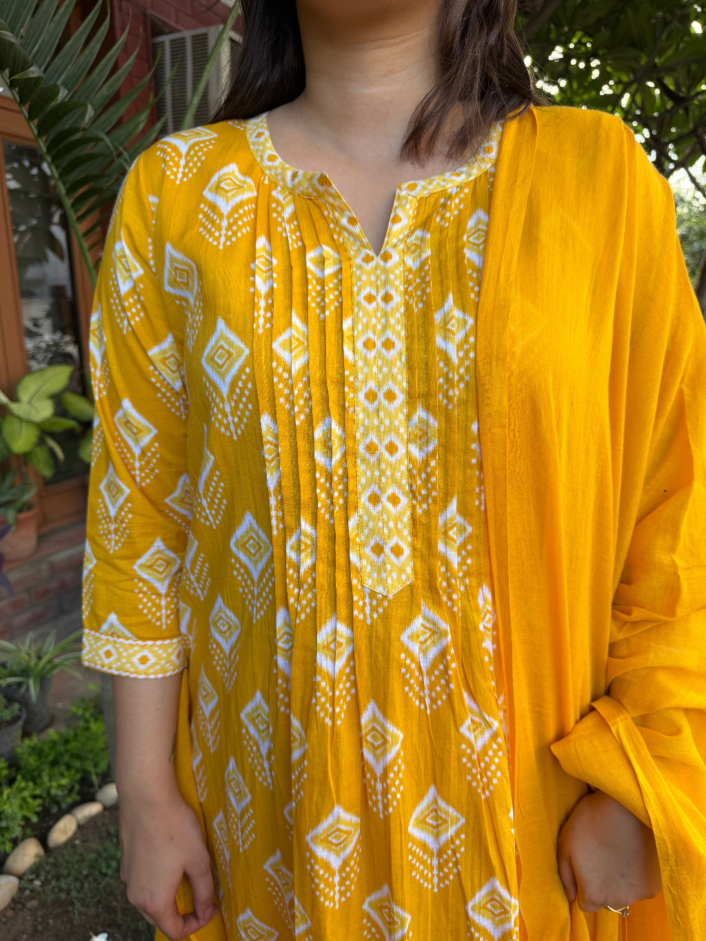 Yellow Ikkat Print Pintucks Suit Set close up by MySanskritam
