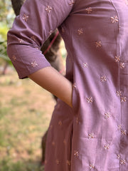 Onion pink embroidered A-line kurta with pockets.