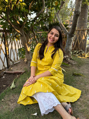 Mustard embroidered A-line kurta with pockets.