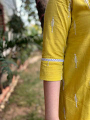 Mustard embroidered A-line kurta with pockets.