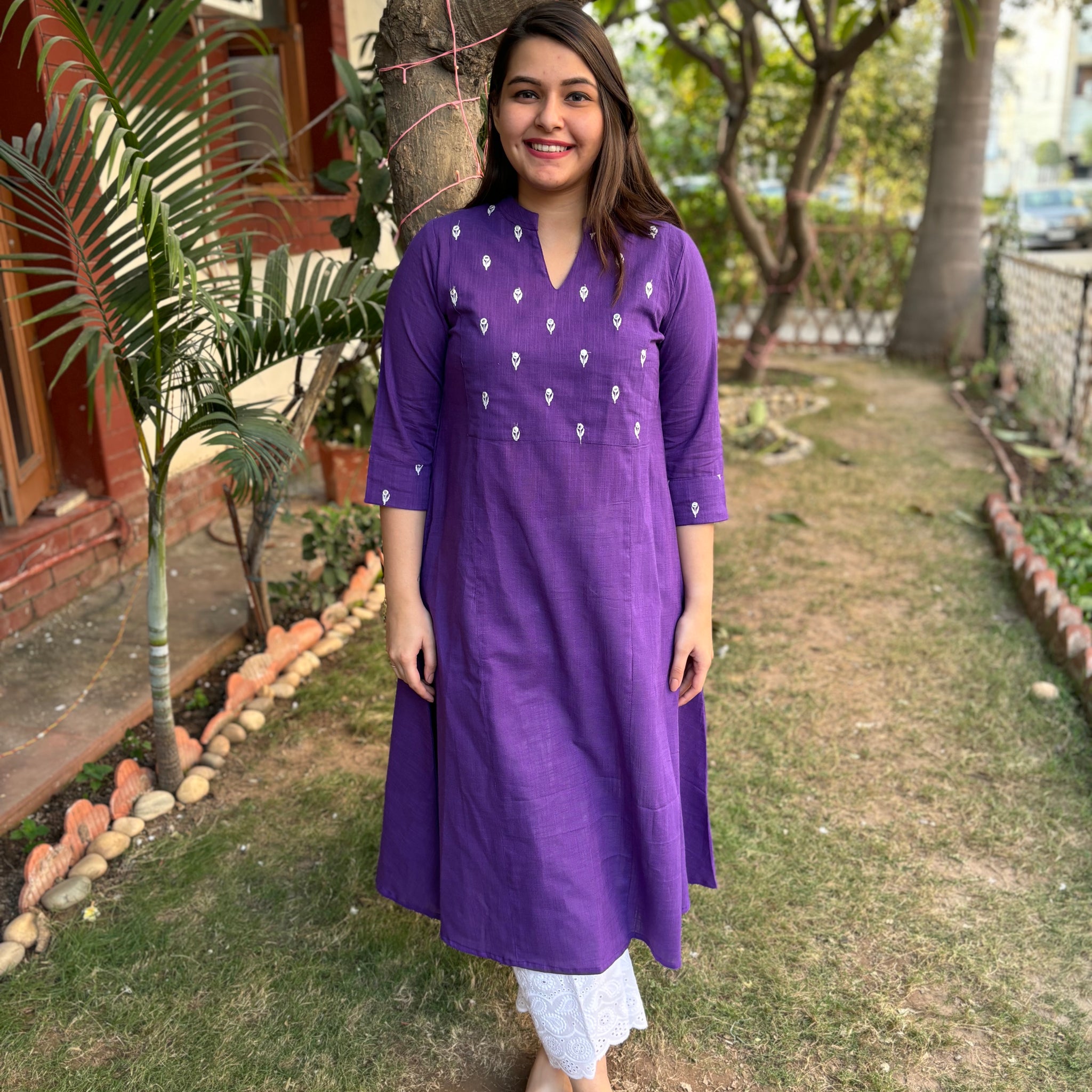 Purple embroidered yoke A-line kurta with pockets.