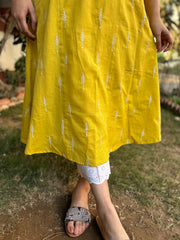 Mustard embroidered A-line kurta with pockets.