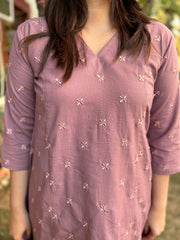 Onion pink embroidered A-line kurta with pockets.