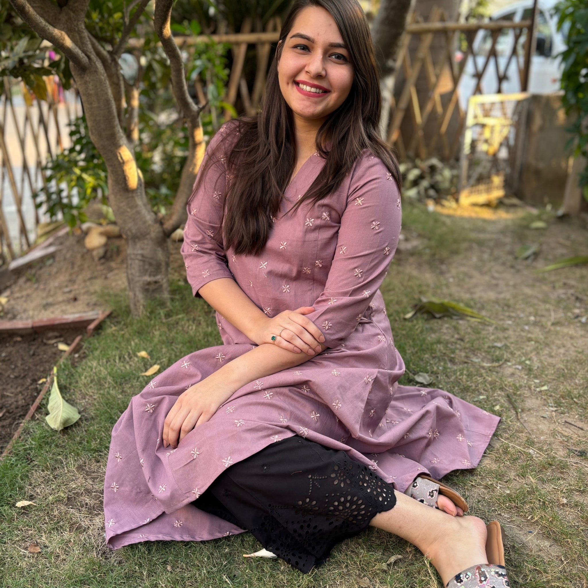 Onion pink embroidered A-line kurta with pockets.