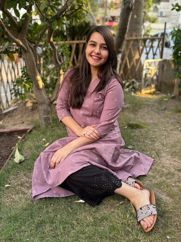 Onion pink embroidered A-line kurta with pockets.