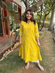 Mustard embroidered A-line kurta with pockets.