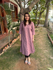 Onion pink embroidered A-line kurta with pockets.