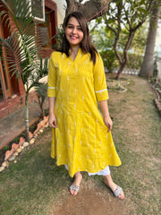 Mustard embroidered A-line kurta with pockets.