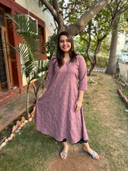 Onion pink embroidered A-line kurta with pockets.