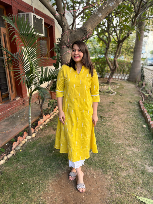 Mustard embroidered A-line kurta with pockets.